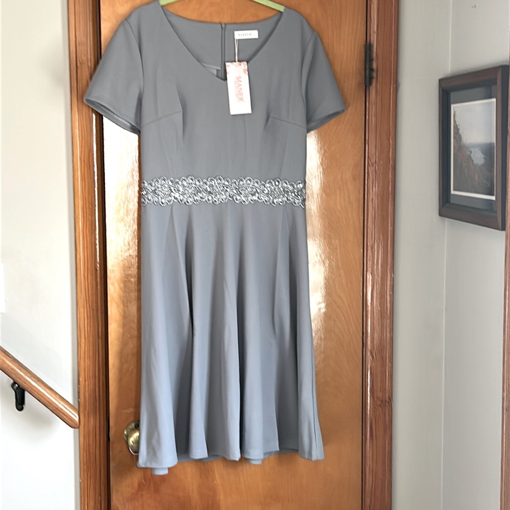 Manner dress. Size large.  Approx 12.  Gray color